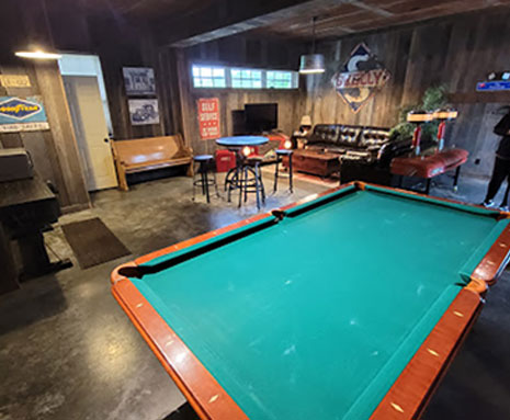 The Home Place at Valley View a Kansas City Missouri Wedding Venue includes a Groom's Room with a pool table, sofa and love seat and Flat Screen TV.